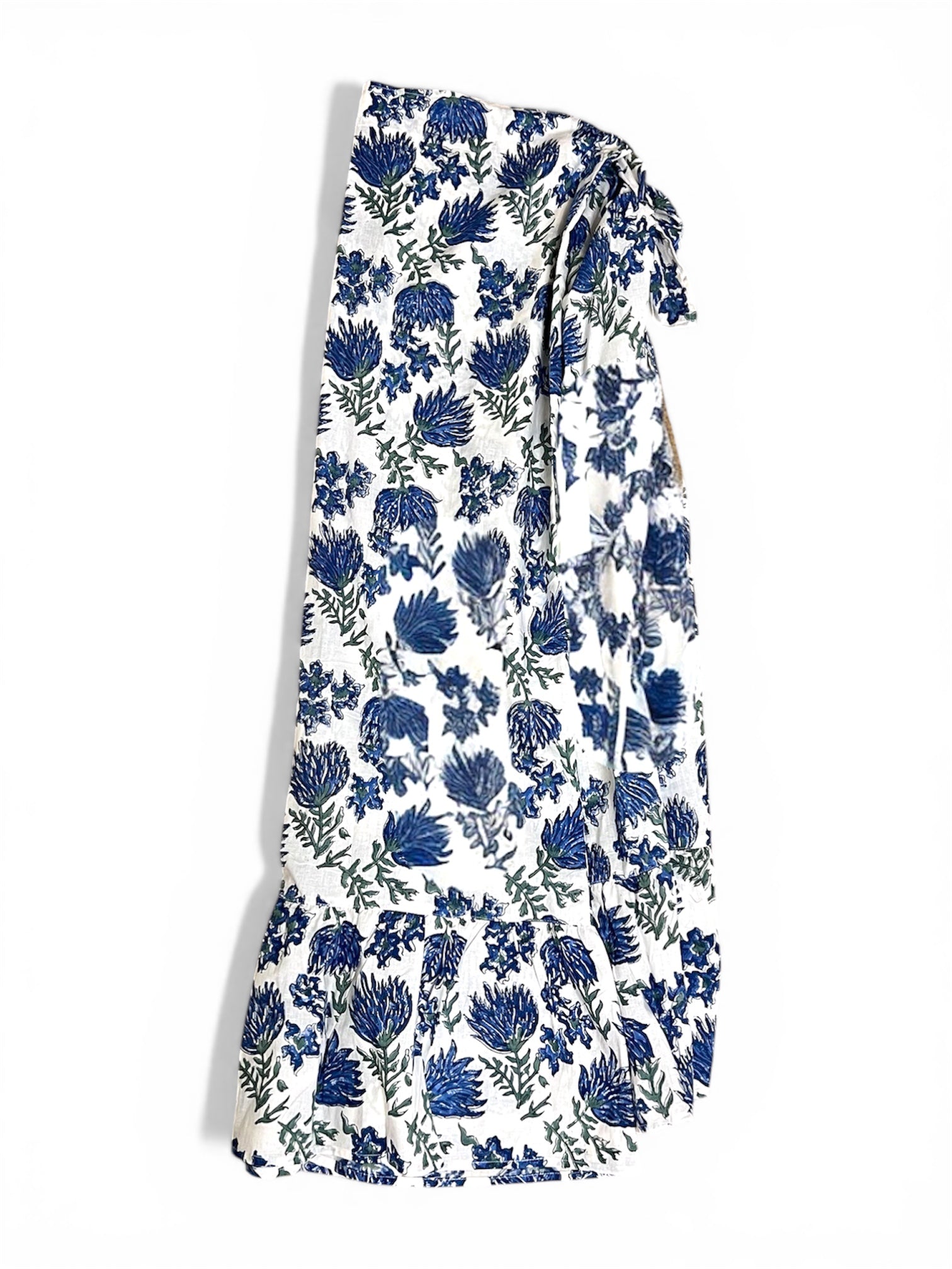 White wrap skirt with blue floral pattern on a white background